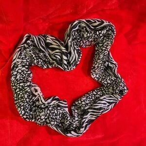 Black and white infinity scarf. Worn once. Looks brand new.